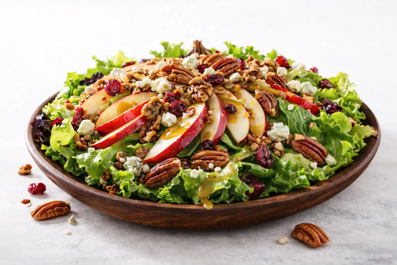 Wendy's Apple Pecan Salad with crisp lettuce, Pomegranate Vinaigrette, apple slices.